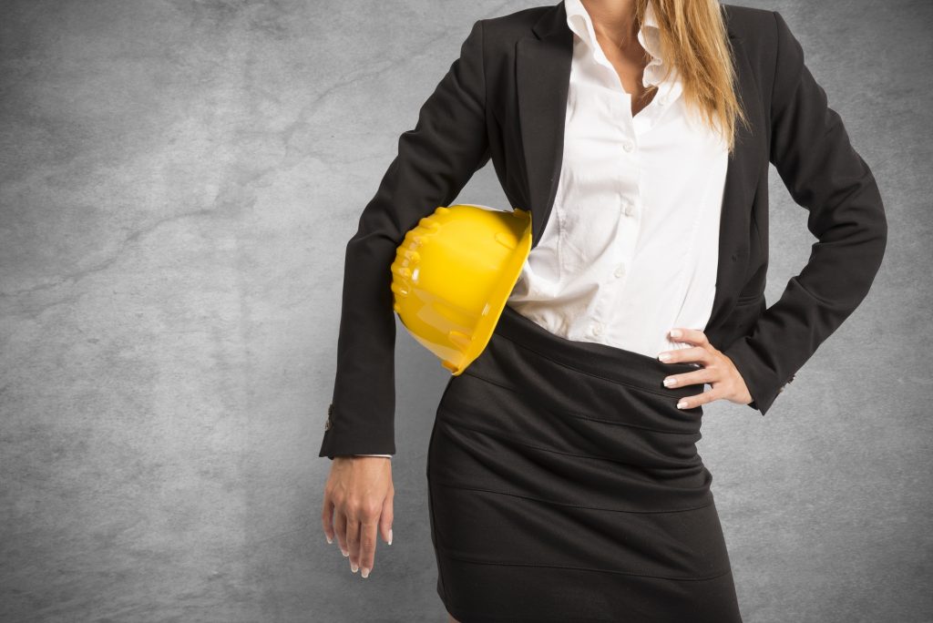 Concept of woman at work with yellow helmet